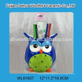 Promotional ceramic utensil holder with owl shape